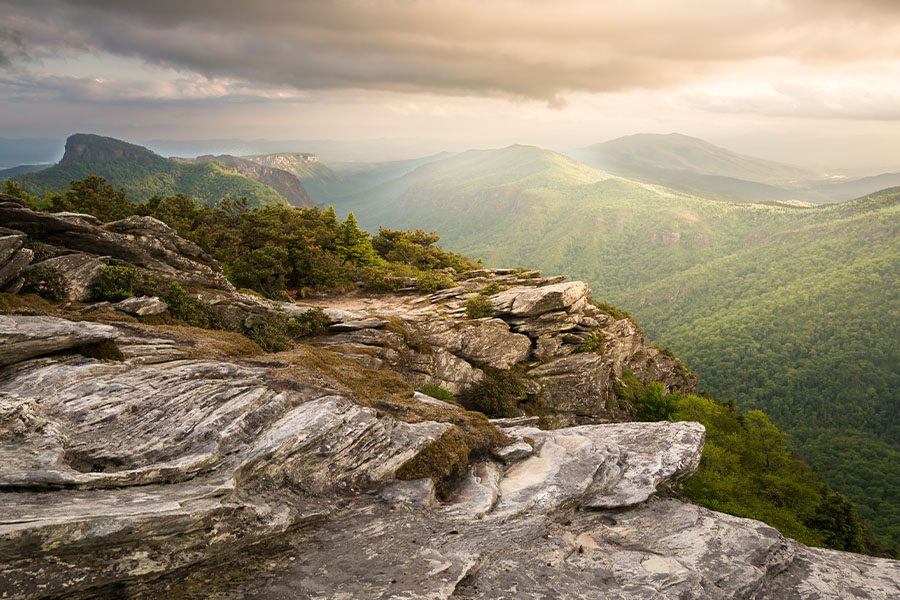Contact - View of Rocky Ridge and Mountains in the Distance From Hawksbill Summit at Sunset in North Carolina